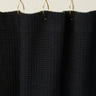 Simple waffle shower curtain in black