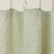 Simple waffle shower curtain in sage.