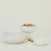 Three Simple Marble Bowls in various sizes in White, with nuts.