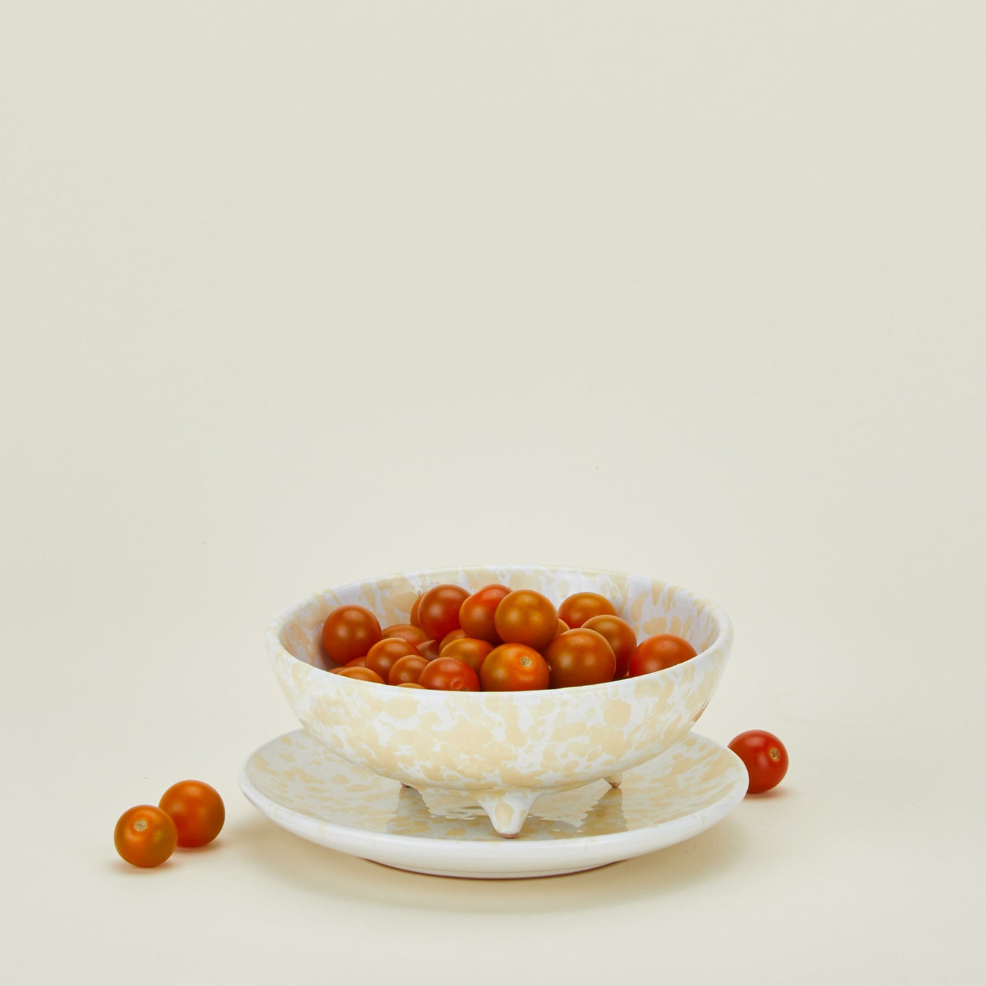 Splatterware berry bowl in ivory and white with cherry tomatoes