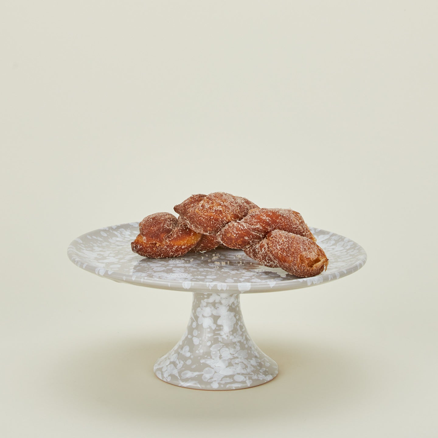 Splatterwware cake stand in grey and white with baked goods