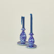 Large and small splatter candle stick holders in sky and cobalt with candles