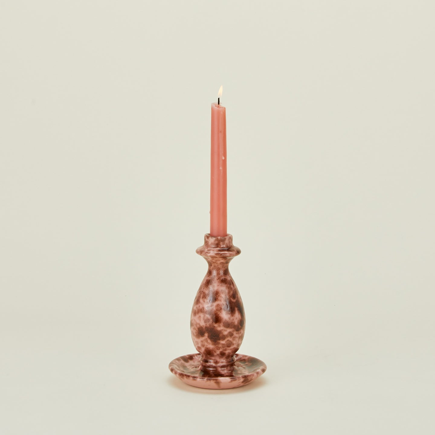 Large splatterware candlestick holder in blush and terracotta with candle