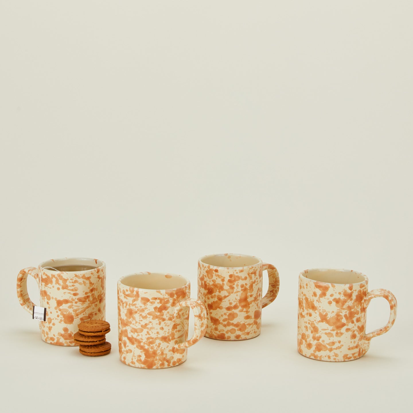 Splatterware mugs set of 4 in ivory and bronze with tea and cookies