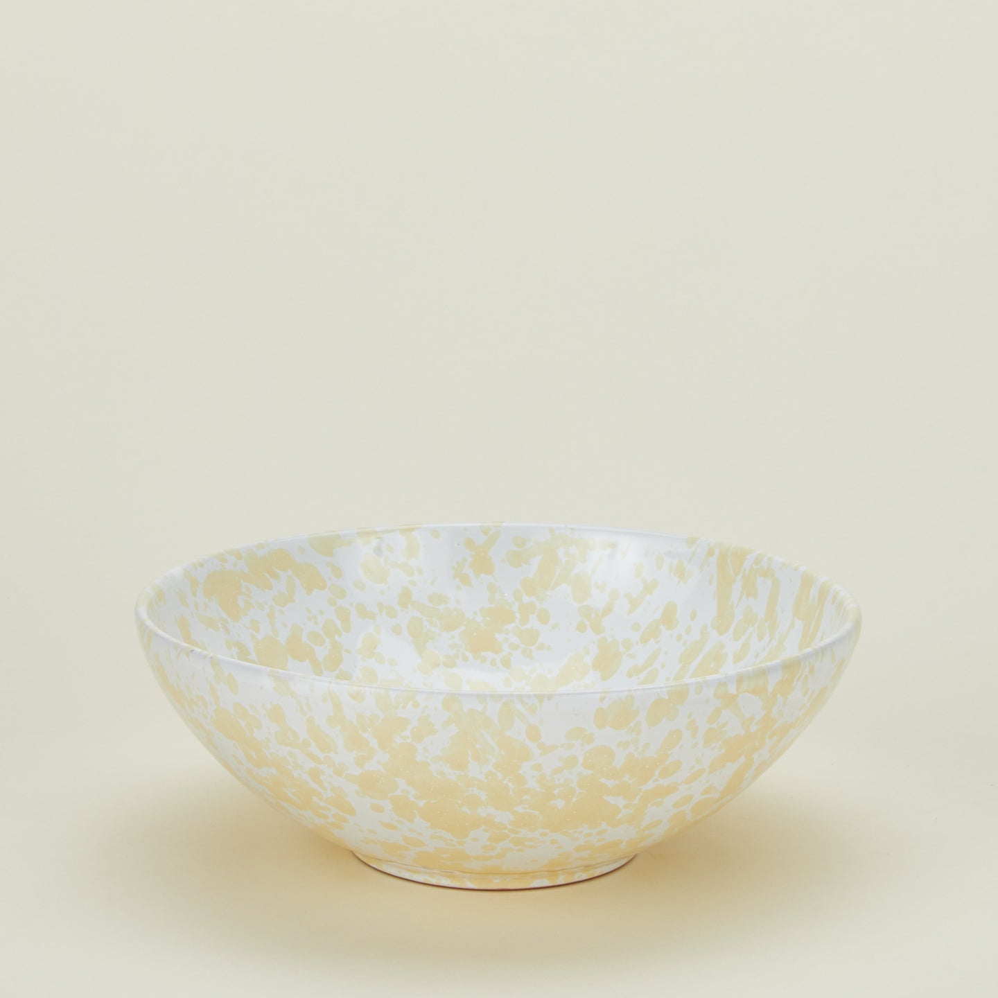 Splatterware serving bowl in white and ivory