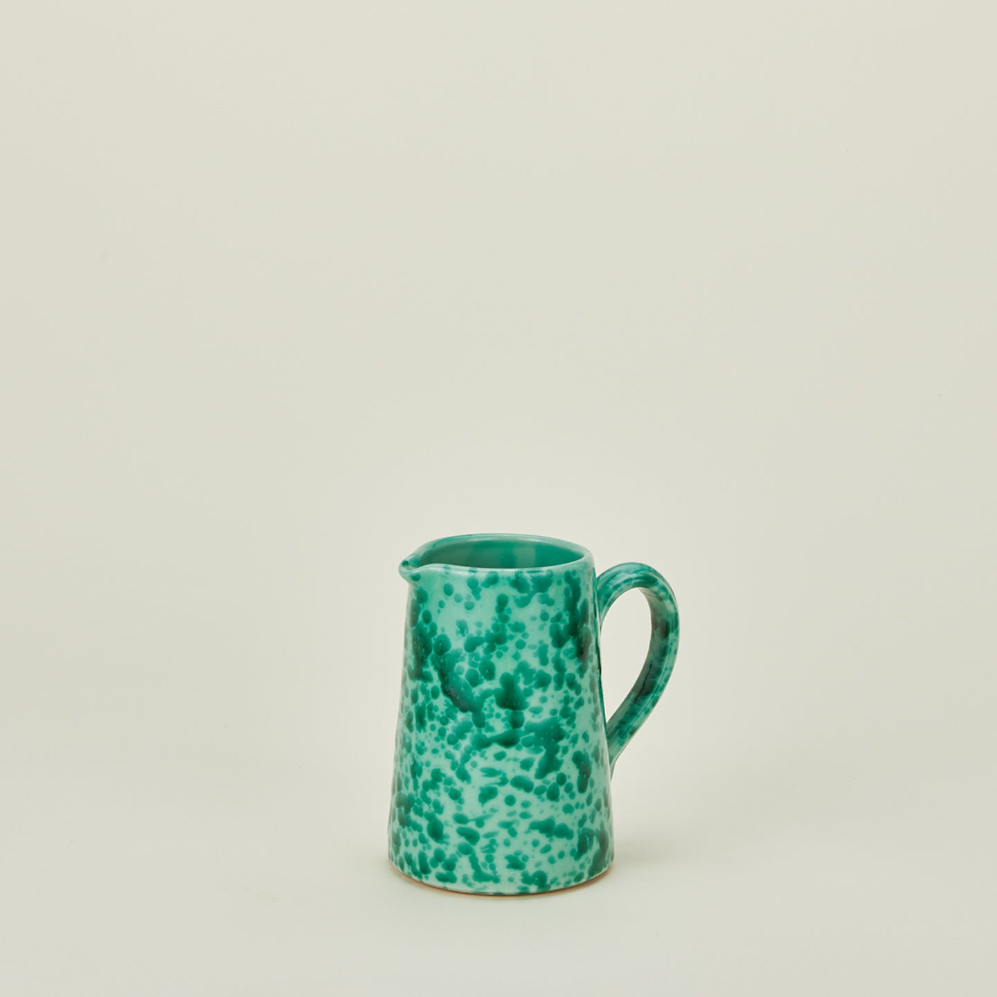 Small splatterware pitcher in sage and green