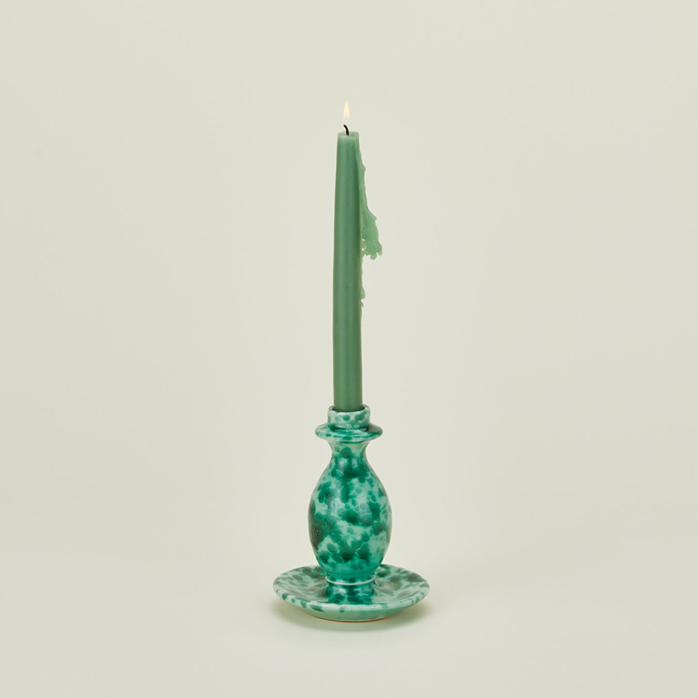Small splatterware candlestick holder in sage and green with candle