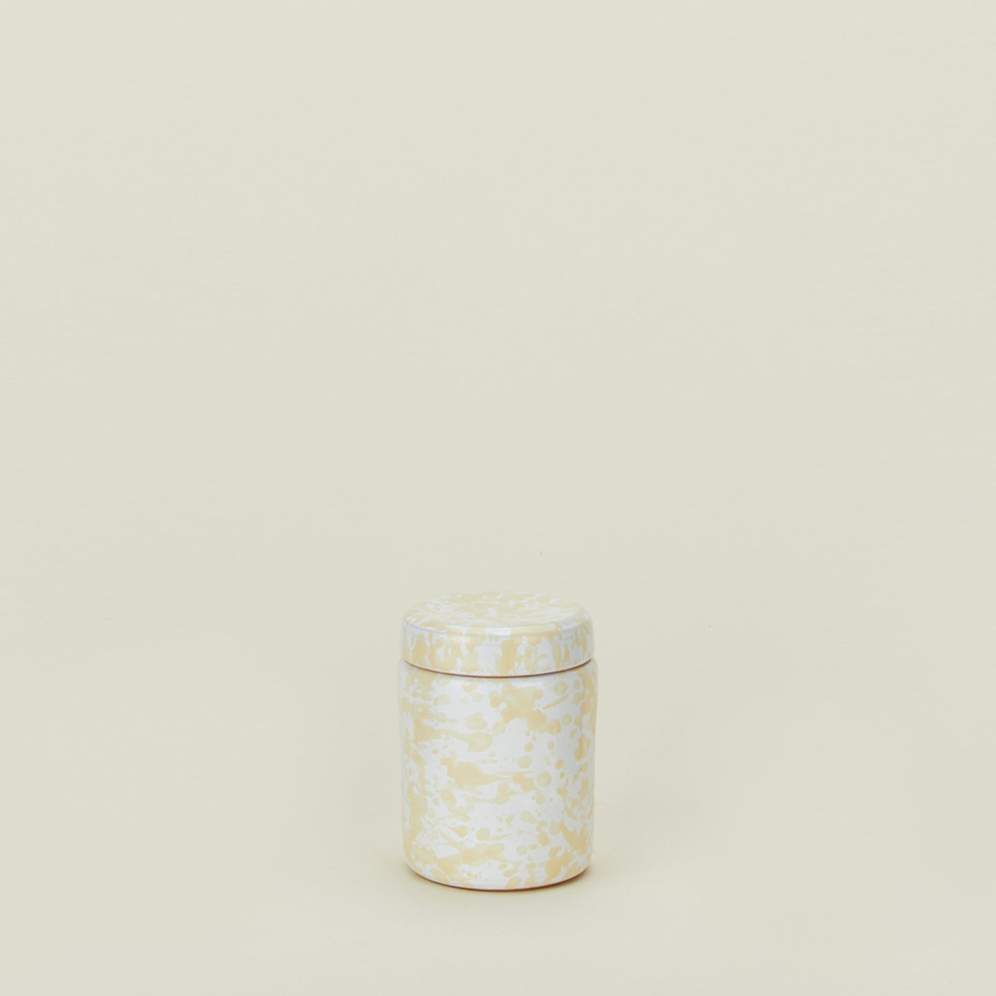 Small splatterware canister in white and ivory
