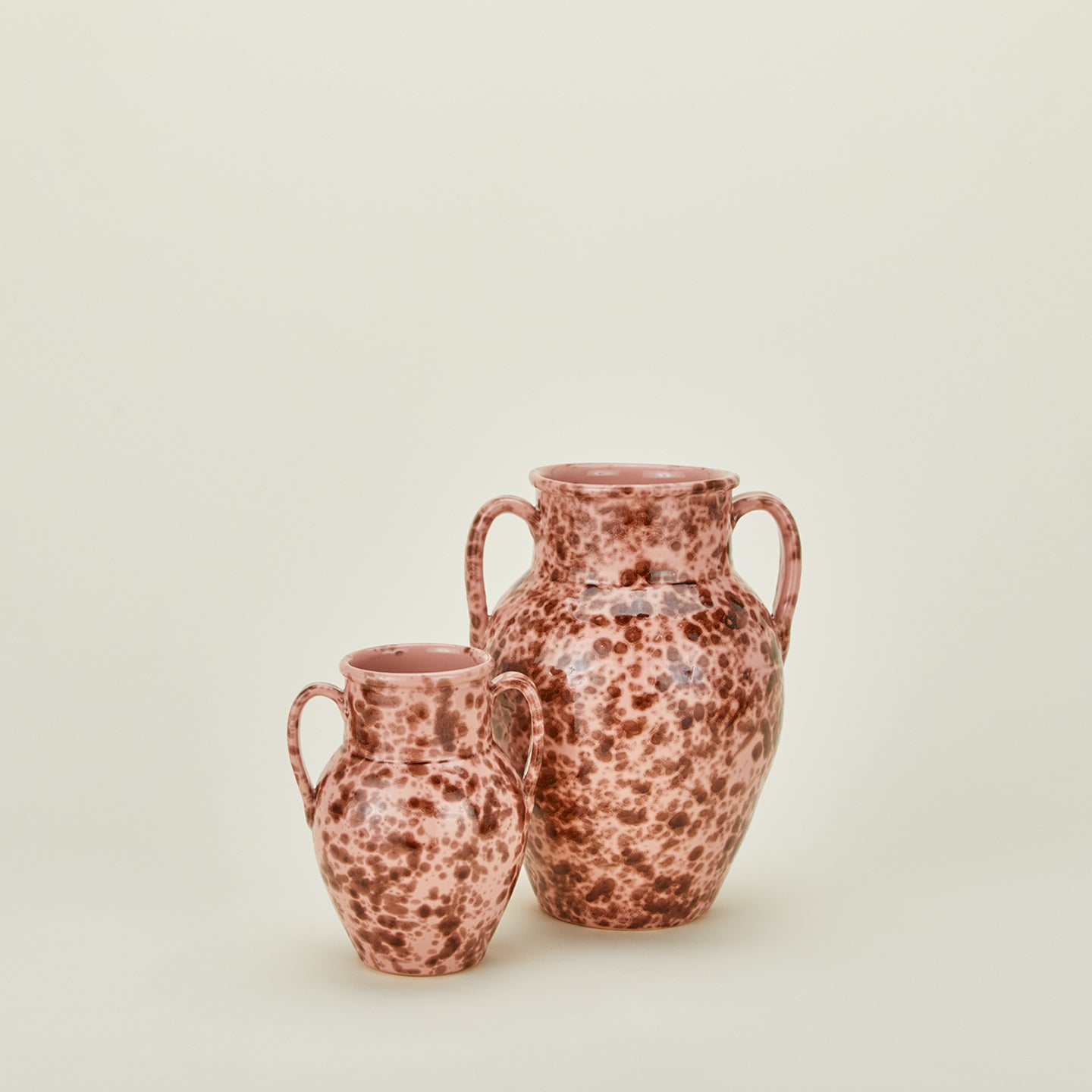 Large and small splatterware vases in blush and terracotta