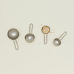 The collective foreged pewter measuring cups, set of 4 with oatmeal