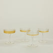 Four Veneziano coupe glasses with champagne.