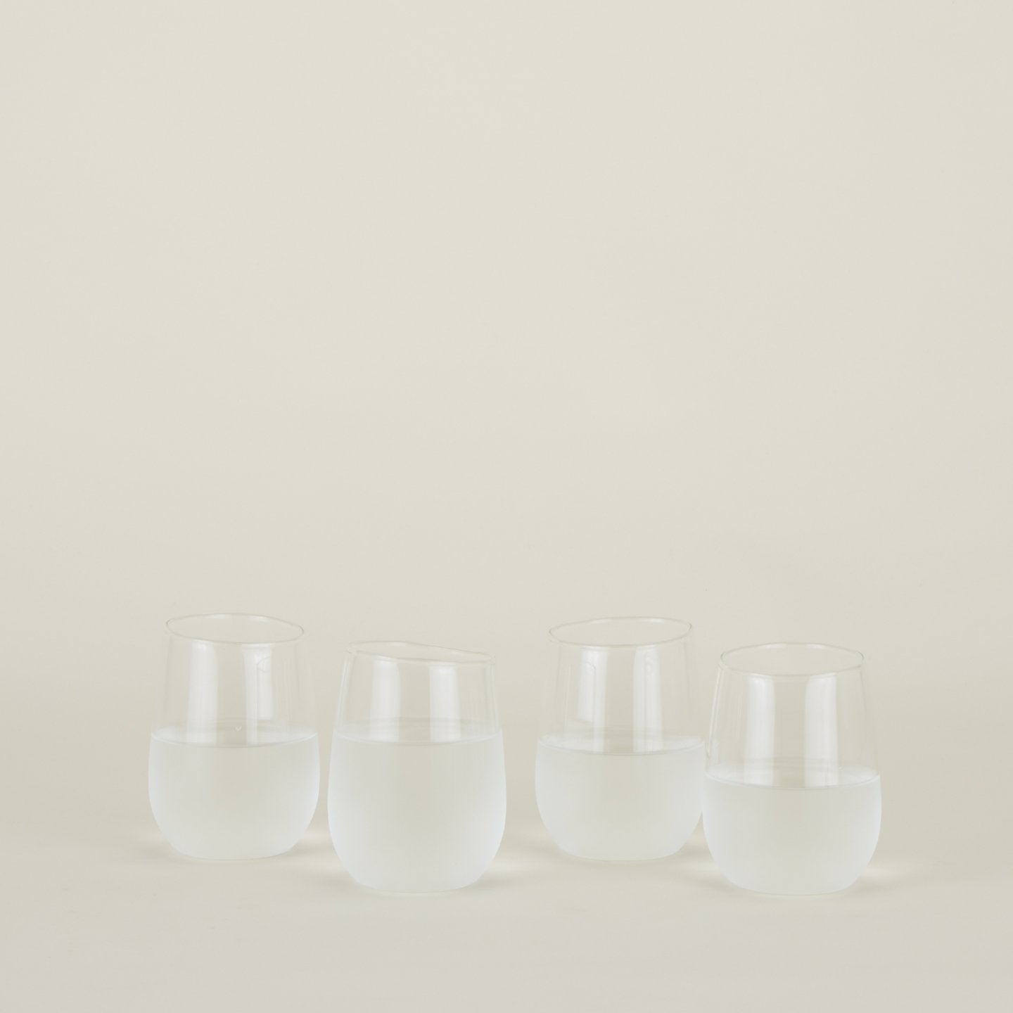 Four clear Boreal Tumblers in Large size filled with water.