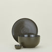 Group of Essential serving pieces in Olive including bowl, platter and extra small bowl.