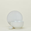Group of Essential serving pieces in Bone including bowl, platter and extra small bowl.