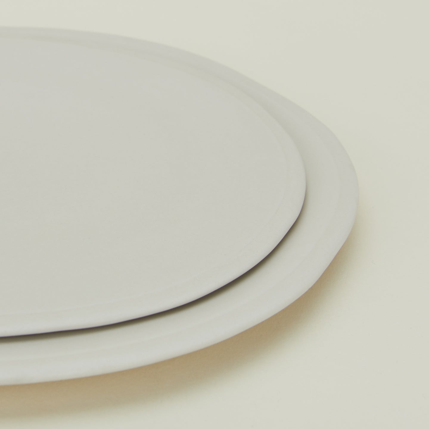 Close up of Atelier Dinner Plate and Atelier Salad Plate stacked.