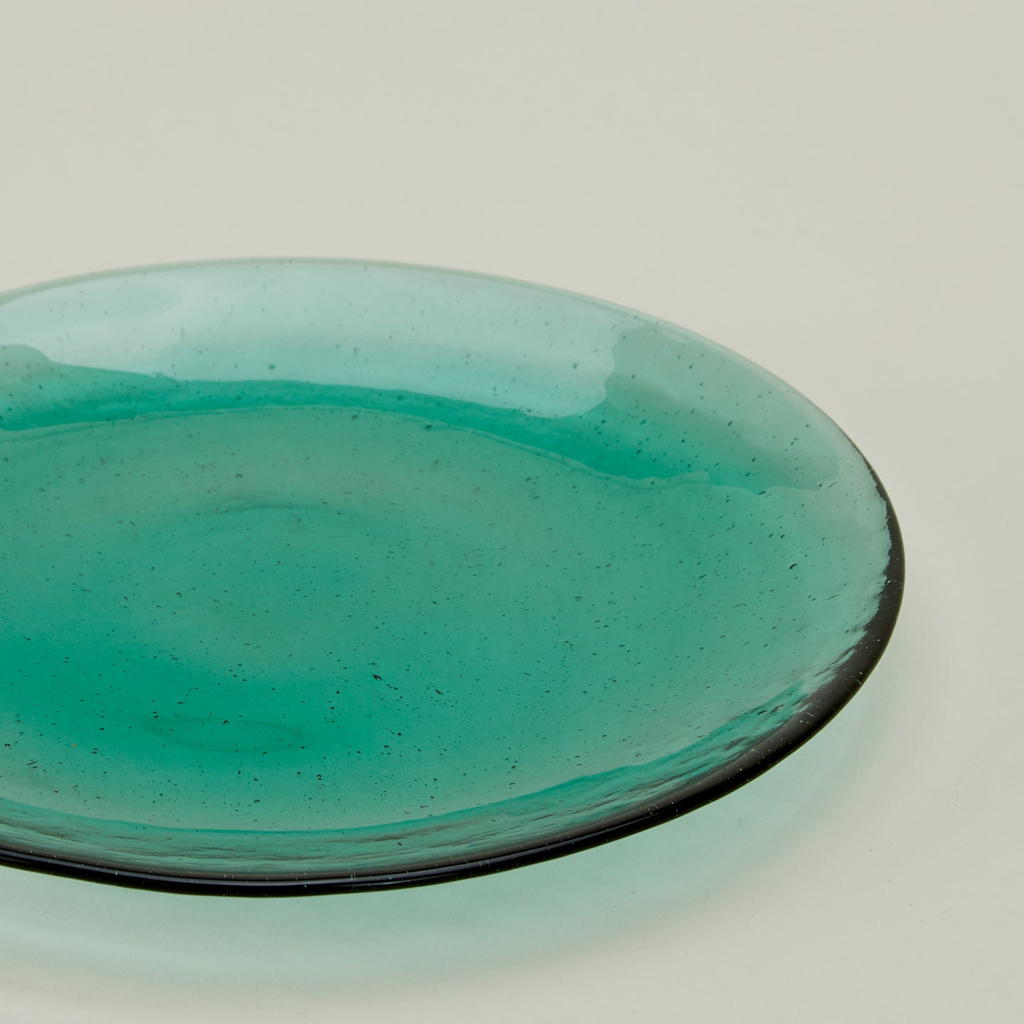 Close up of Glass Dinner Plate in Jade.