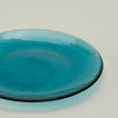 Close up of Glass Dinner Plate in Peacock.
