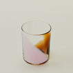 Close up of Blown Glass Tumbler in Blush and Amber.