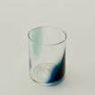 Close up of Blown Glass Tumbler in Sky and Peacock.