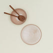 Essential Serving Platter and Serving Platter in Blush, with wood serving utensils.