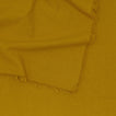 Close up of Essential Striped Tablecloth in Mustard.