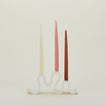 Stoneware Wyat Candelabra with taper candles.